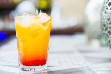 Cocktail with orange juice and ice cubes , Tequi