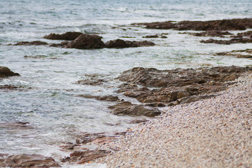 Rocks in the sea on the beech in Cornwall