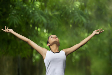 Young woman enjoying nature in a park 