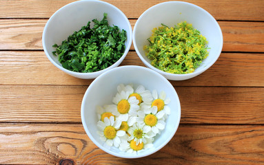 Chamomile pharmacy useful for health on a wooden table