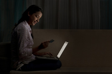 Young woman doing online shopping 