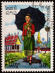 Fototapeta na wymiar Woman in national Lao dress on postage stamp