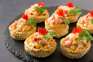 Festive appetizer vol-au-vent with chicken salad, sweet pepper, corn