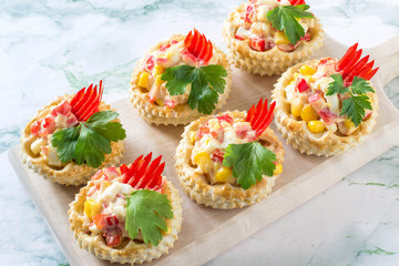 Festive appetizer vol-au-vent with chicken salad, sweet pepper, corn