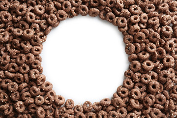 Frame of chocolate corn rings on white background