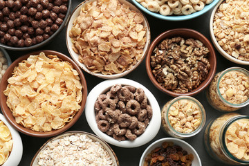 Different healthy breakfast cereals on table