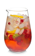 Glass jug of cold lemonade on white background