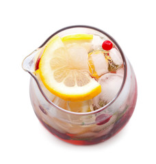 Glass jug of cold lemonade on white background