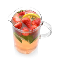 Glass jug of cold lemonade on white background