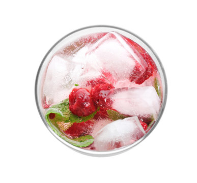 Cold lemonade with raspberry in glass on white background