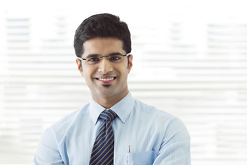 Portrait of young businessman smiling 