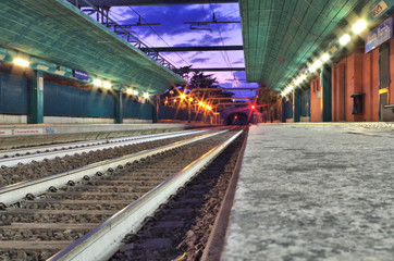 ground view of a lit train railway