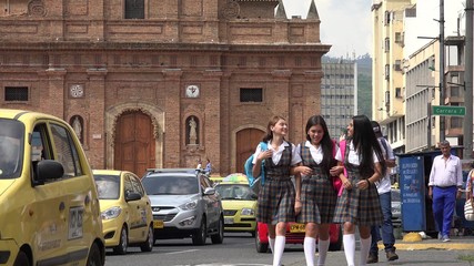 Female Students Walking In Urban Area