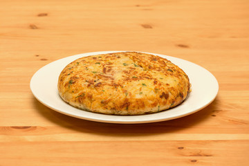 Spanish omelette on wooden background