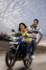 Obraz na płótnie Canvas Couple on a motorbike 
