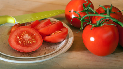 Sliced Tomatoes with knife on left