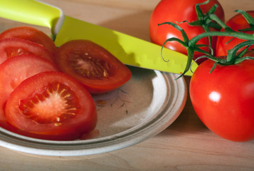 Sliced Tomatoes with knife