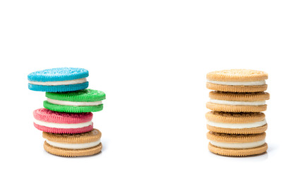colored cream filling cookies stacked isolated on white background