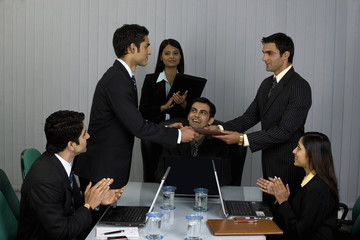 Executive handing a file 