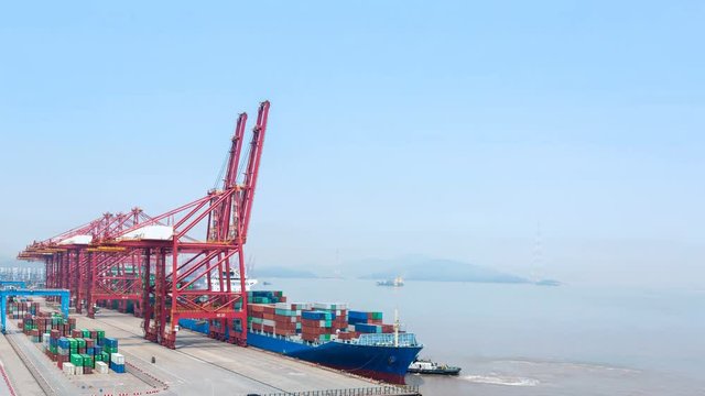 time lapse of container terminal, an ocean-going freighter berth at port of ningbo, China 