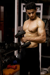 Fototapeta na wymiar Man lifting weights 