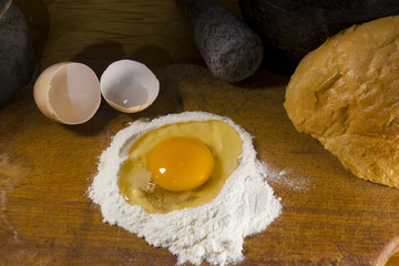 Broken egg in flour