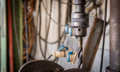 Close-Up Drilling machine in factory workshop.