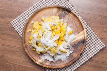 Sweet Corn with coconut and sugar on wooden plate