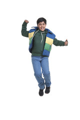Portrait of boy jumping in the air