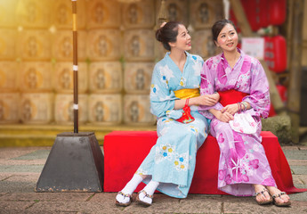 best girlfriends sitting on the culture street
