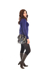 full length portrait of brunette woman wearing modern casual clothes. standing pose, isolated on white background