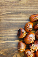 Roasted chestnuts on wooden table