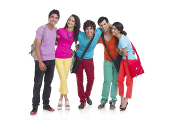 Fototapeta premium Full length portrait of university students smiling together over white background