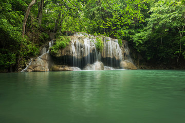 Fototapeta na wymiar Scenery green waterfall at deep forest, Erawan waterfall located Kanchanaburi Province, Thailand