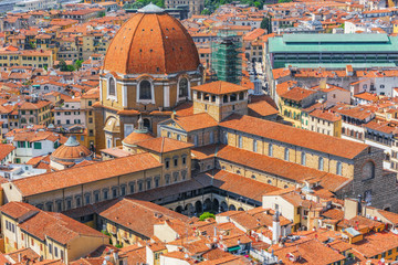 Fototapeta na wymiar Beautiful landscape above urban and historical view of the Florence from Giotto's Belltower (Campanile di Giotto).The Medici Chapel (Cappelle Medicee).Italy.