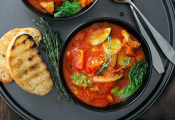 Two bowl of soup minestrone with seasonal vegetables
