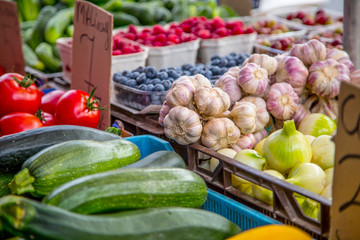 Various fruits and vegetables on the farm market in the city. Fruits and vegetables at a farmers market
