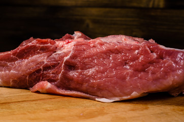 Raw pork meat on cutting board