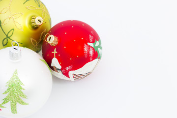 Beautiful white, red and green christmas balls on white background.