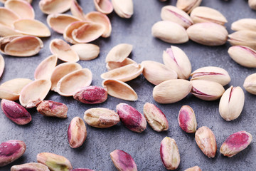 Pistachios on grey wooden table