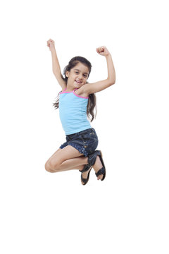 Little girl jumping in the air 