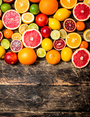 Citrus background. Fresh citrus fruits - Lemons, oranges, limes, grapefruits.