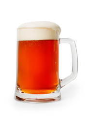 Amber colored beer mug with foam. Isolated with clipping path