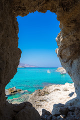 Amazing view of Koufonisi island with magical turquoise waters, lagoons, tropical beaches of pure white sand and ancient ruins on Crete, Greece