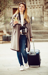 Traveling woman walking in the city