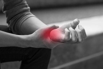 man suffering from trigger finger, arthritis, wrist pain