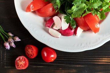 Fresh salad of tomatoes, cucumbers, peppers, arugula and dill jpg