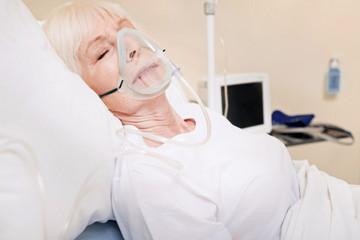 Aged tender lady having problems with her lungs
