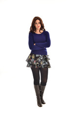 full length portrait of young woman wearing black professional office outfit. standing pose, isolated against white background.