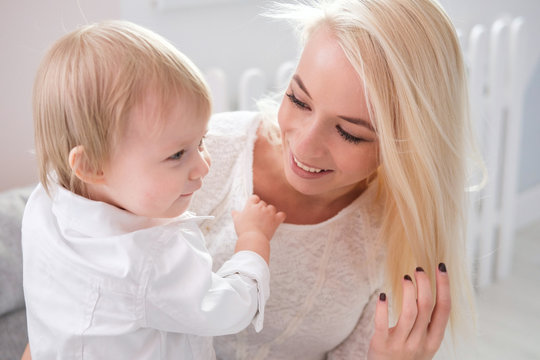 Closeup portrait of cute mother with daughter at home